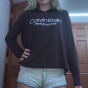 A maroon Calvin Klein performance hoodie